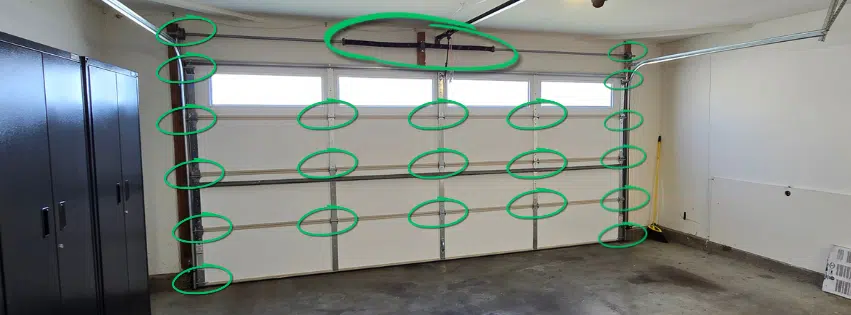 Diagram showing 21 garage door maintenance lubrication points on a two-car door including hinges, rollers, springs, top and bottom fixtures, and end bearing plates — Generational Garage Doors Martinez CA