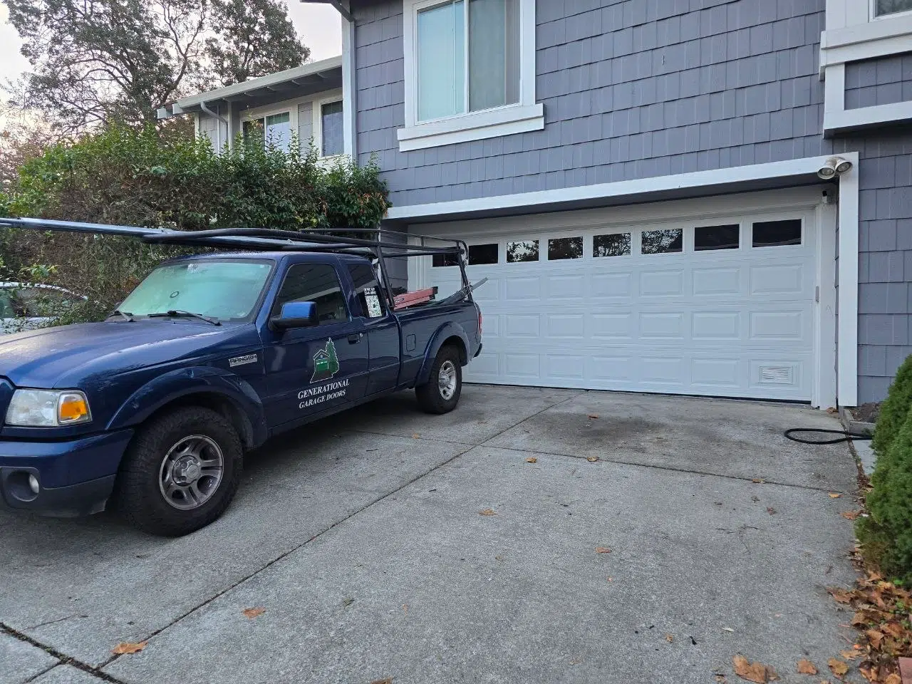 Generational Garage Doors marked service truck in front of a residential garage door in Martinez CA — locally owned and operated garage door service Contra Costa County