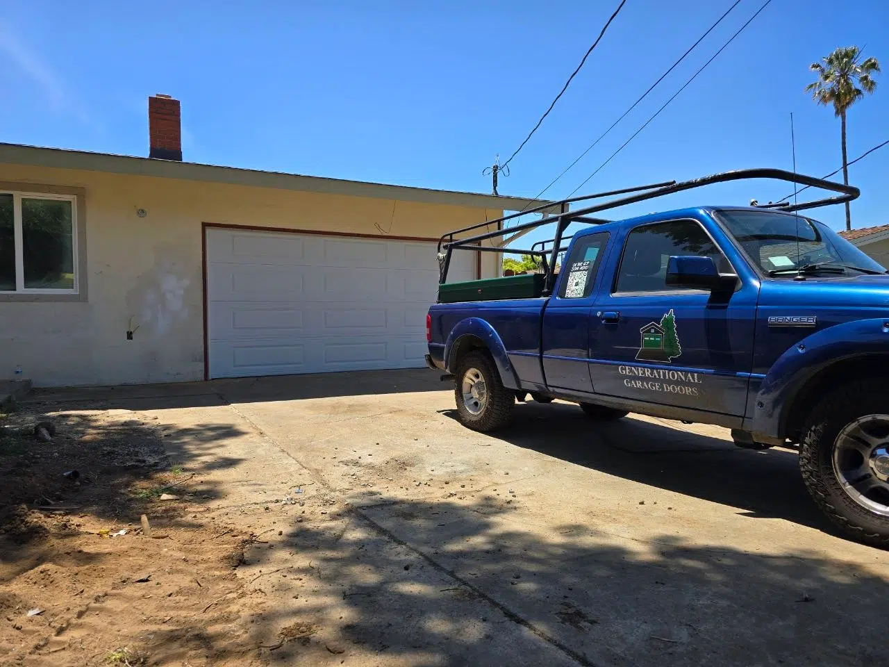 Generational Garage Doors marked service truck parked in front of a residential garage door in Martinez CA — locally owned and operated