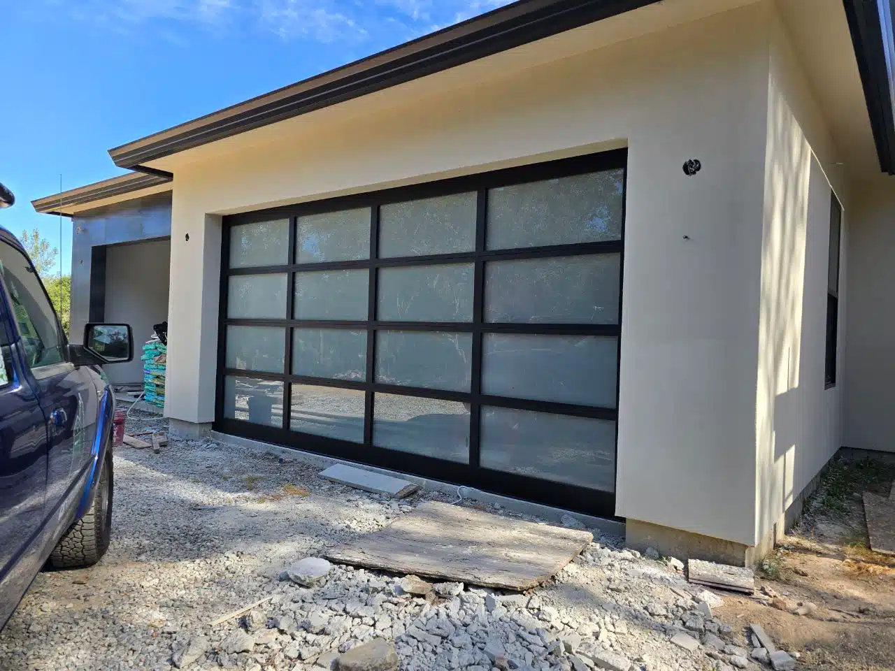 Installed full-view aluminum-frame glass garage door