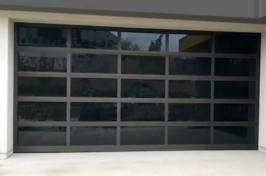 Alumadoor full-view glass garage door with dark bronze anodized frame